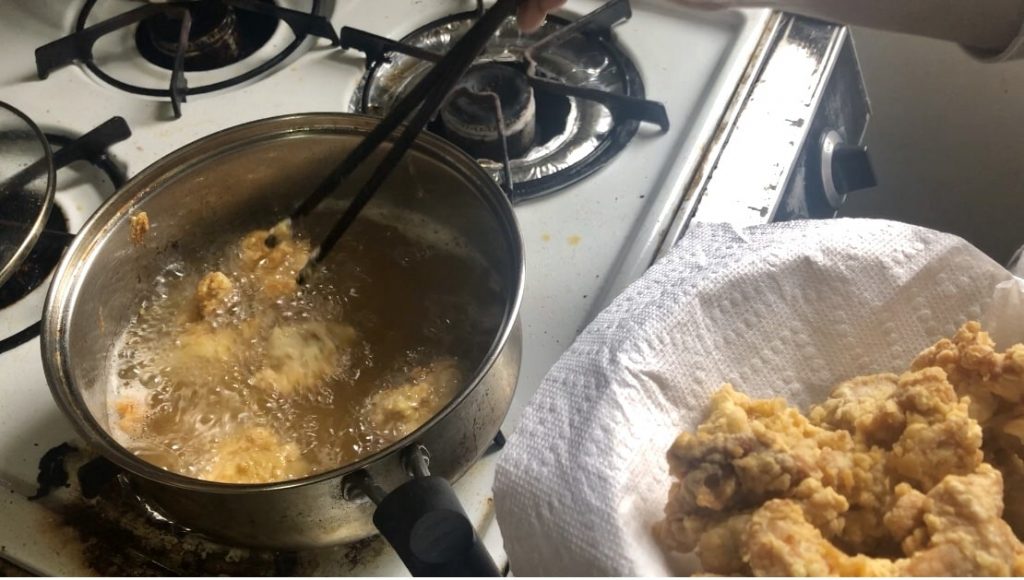 frying popcorn chicken in a pot