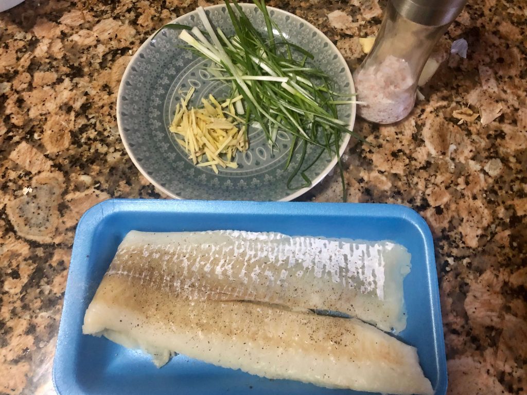 season cod fillet with salt and pepper