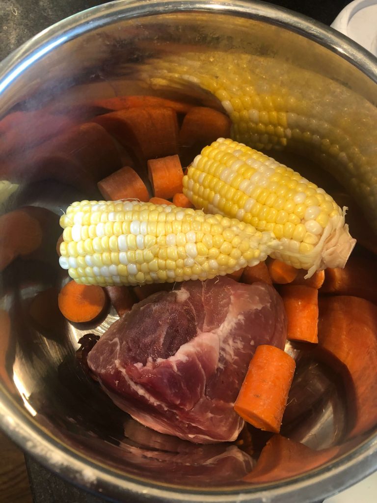 Corn, carrots, pork, ginger and dry date in a pot